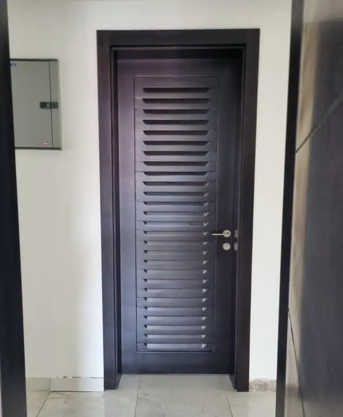 Jalousie door made by Nova Doors in Accra, Ghana (photo 3 of 4)