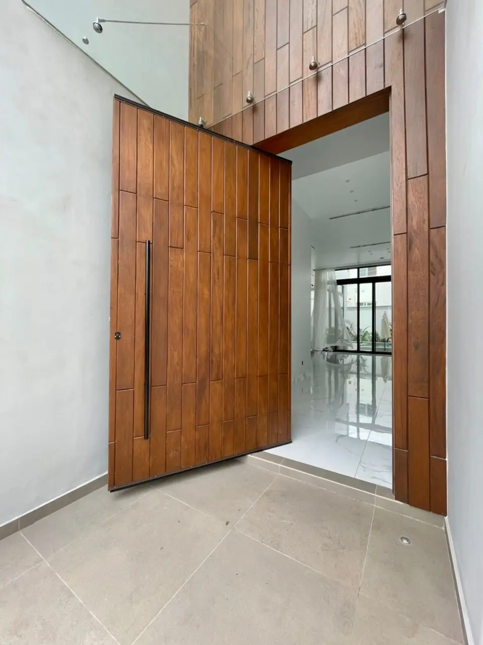 Pivot door made by Nova Doors in Accra, Ghana (photo 2 of 31)