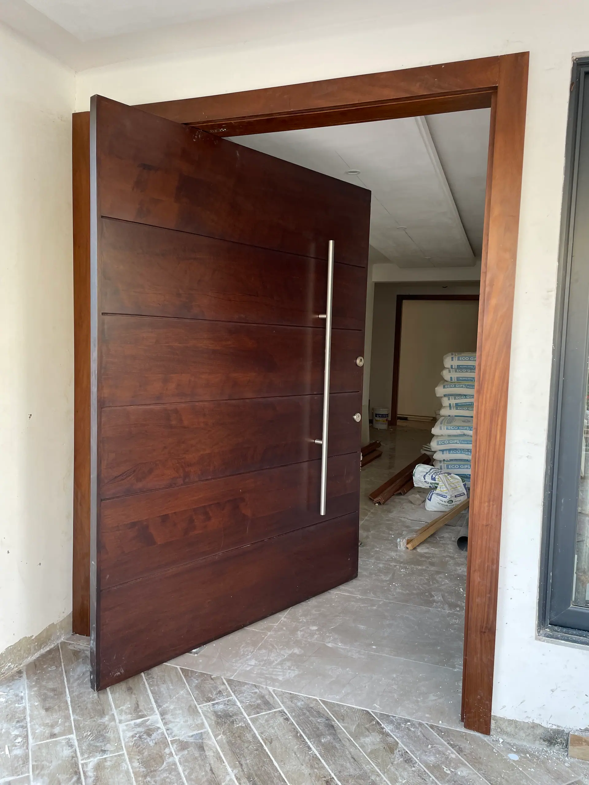 Custom pivot door made by Nova Doors in Accra, Ghana