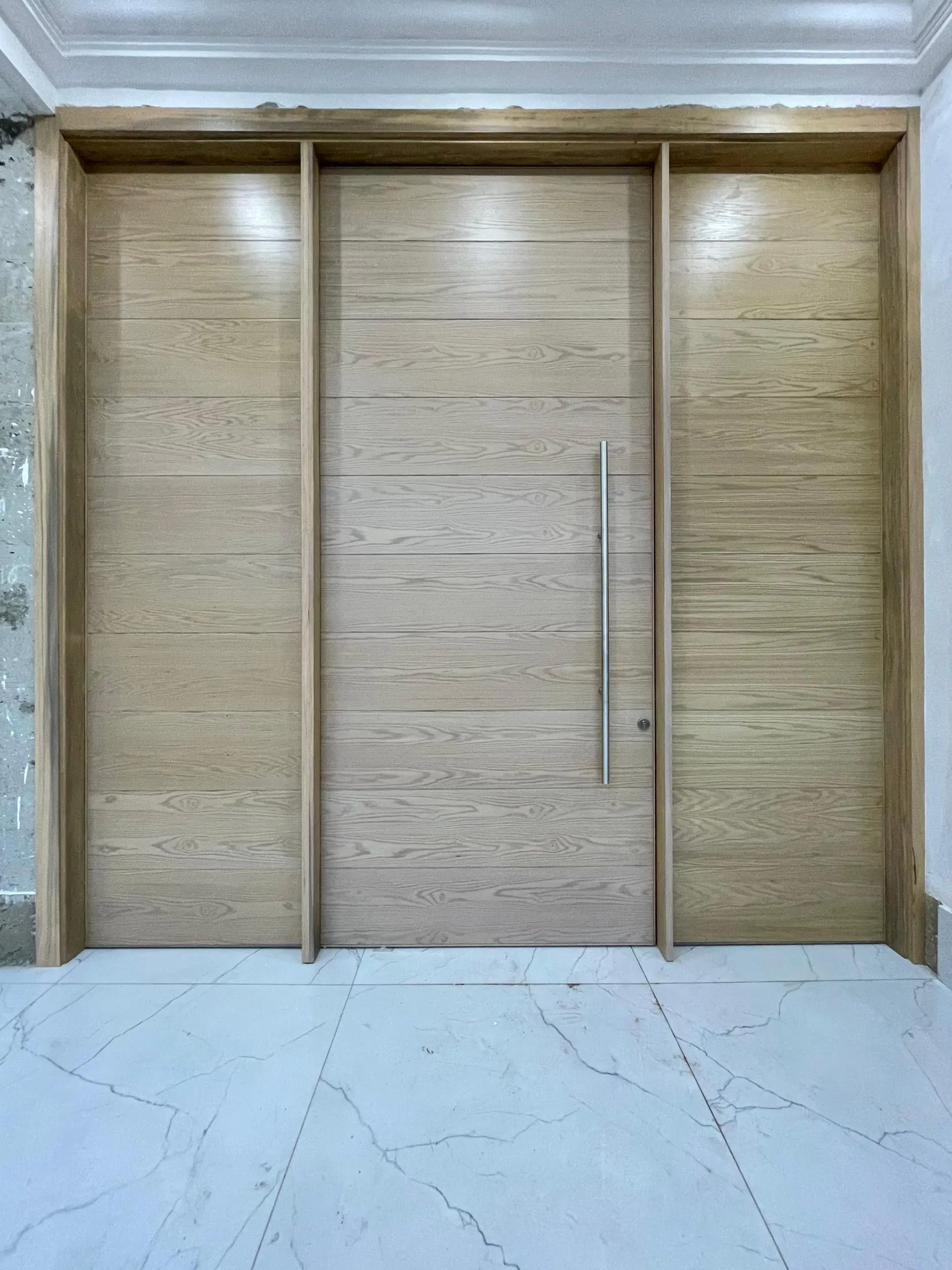 Custom pivot door made by Nova Doors in Accra, Ghana