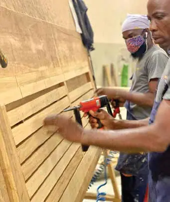 Assembly in the Nova Doors factory, Accra